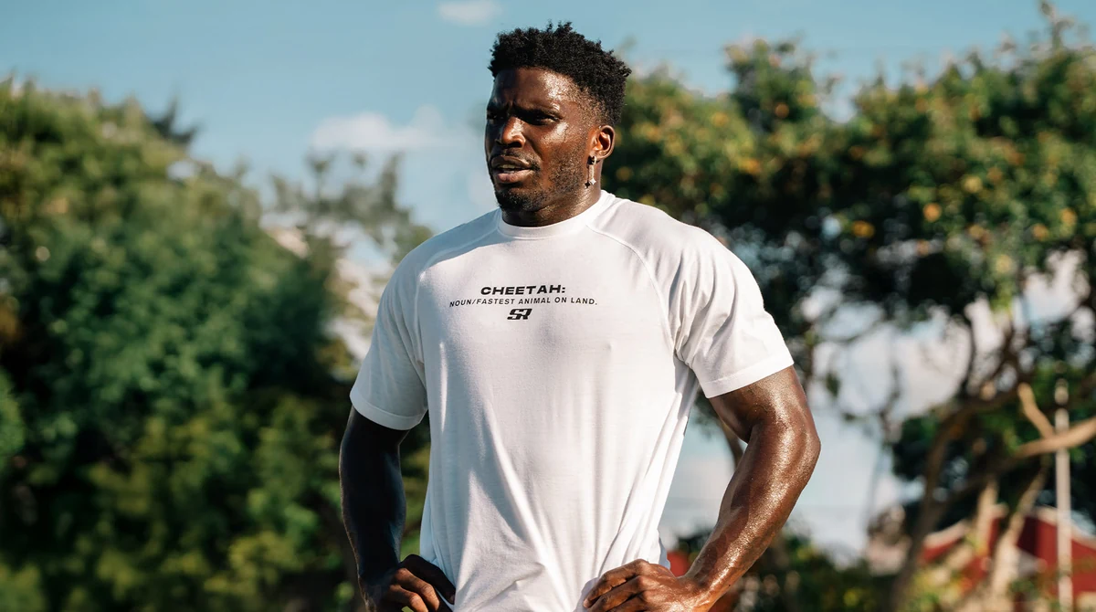Tyreek Hill wearing a Soul Runner Cheetah shirt in ZAG’s campaign